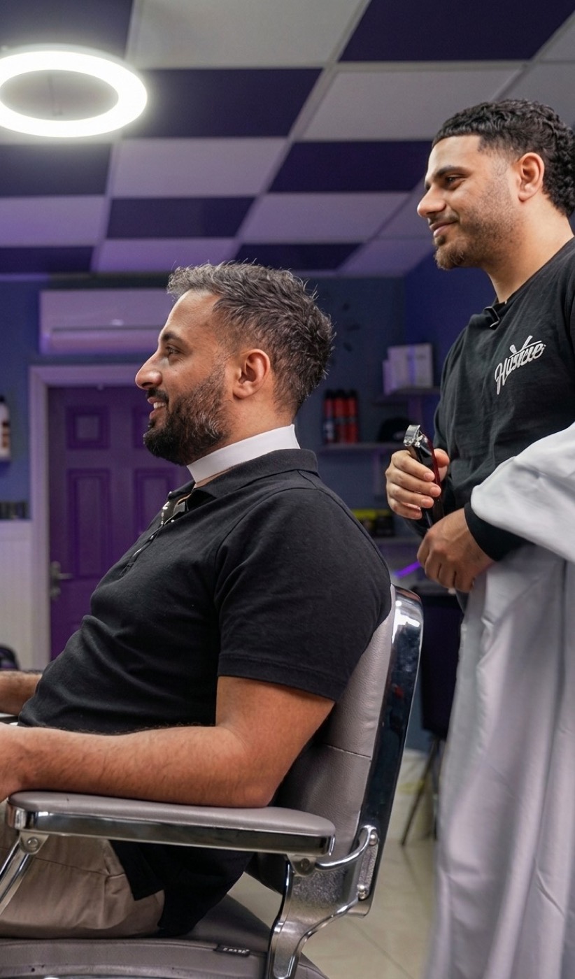 A barber chatting with a regular in the chair